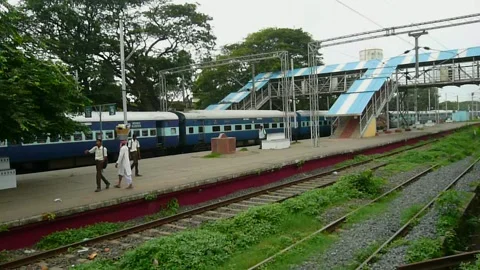Indian railways Passenger express train moving speed at Station platform India Stock Footage 137386892