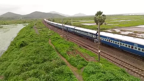 Indian Railways Passenger Express Train speed countryside Aerial Vaitarna India Stock Footage 141564610