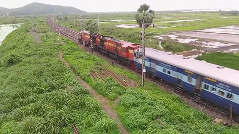 Indian Railways Passenger Express Train speeding countryside Aerial Mumbai India Video stock 141566119