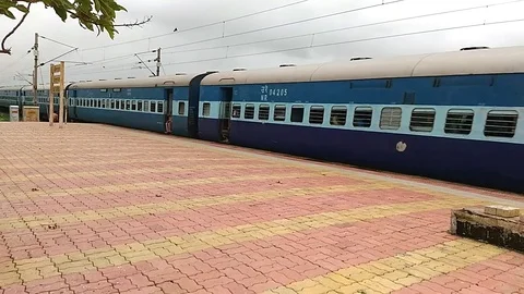 Indian railways passenger Train Crossing Vaitarna Railway station, Mumbai India Video stock 106342853
