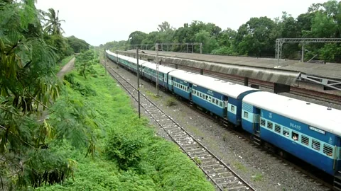 Indian railways passenger Train moving ,Vangaon station Dahanu Maharashtra India Stock Footage 306773220
