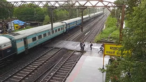 Indian Railways Passenger Train speed Aerial Countryside Malavli Station India 스톡 동영상 137808686