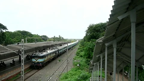 Indian railways passenger Train speed, Vangaon station Dahanu Maharashtra India Stockbeeldmateriaal 306773202