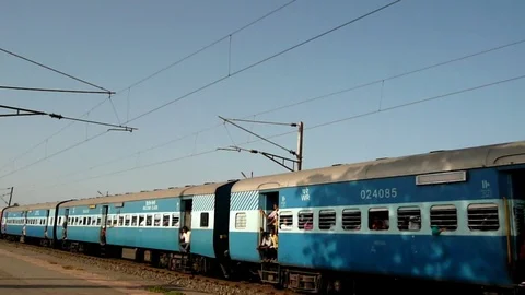 Indian railways passenger Train speeding, Vaitarna Railway station, Mumbai India Stock Footage 106553078