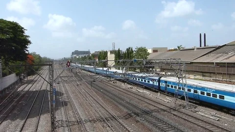 Indian railways passenger Train speeding near Vile Parle station, Mumbai India Stock Footage 107460473