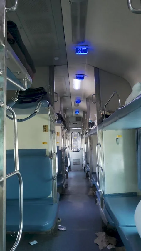 Indian railways sleeper class coach. The empty berths and litter on the floor Stock Footage 335878233