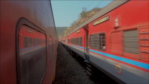 Indian Railways train waiting to giving pass for oncoming traffic from opposite. Stock Footage 140090818