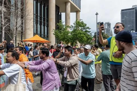Indian religious devotees march in line at Parramatta Square Stock Photos