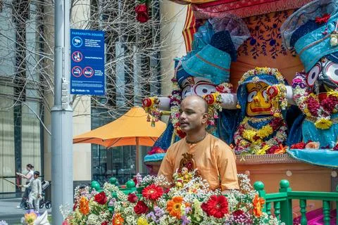 An Indian religious Hare Krishna devotee sitting on a float Stock Photos