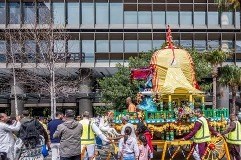 An Indian religious Hare Krishna devotee sitting on a float Stock Photos