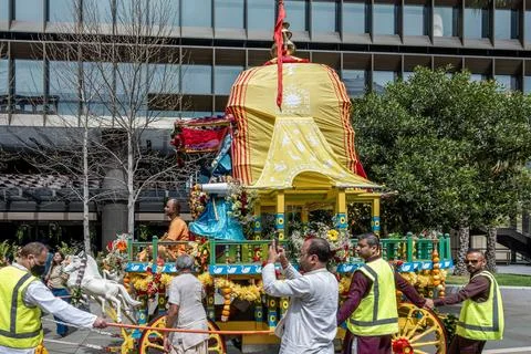An Indian religious Hare Krishna devotee sitting on a float Stock Photos