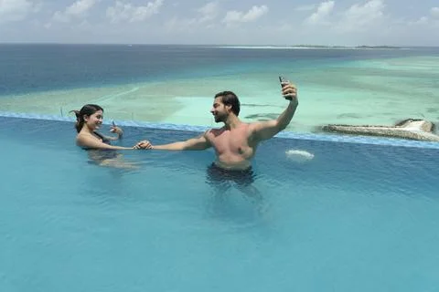 Indian romantic couple in Maldives enjoying Stock Photos