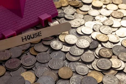 Indian Rupees Coins Spread on Table with House Word in Stick Stock Photos