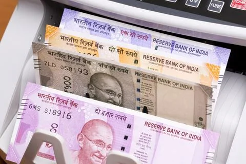 Indian rupees in the counting machine Stock Photos