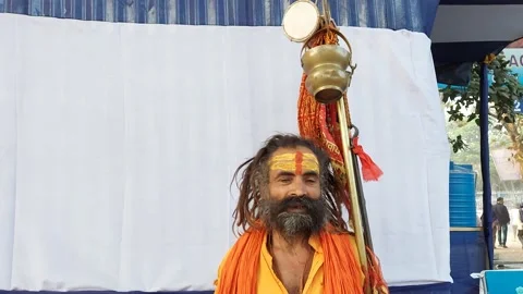 An Indian sadhu introducing himself in front of a camera Stock Footage 229574821