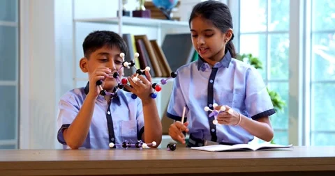 Indian School Kids Studying Atom Model Using 3D Tool in Classroom Science Video stock 342849875