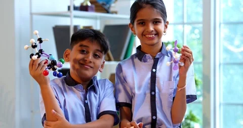 Indian School Kids Studying Atom Model Using 3D Tool in Classroom Science Stock Footage 342849907