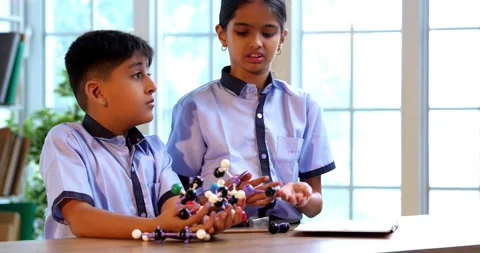 Indian School Kids Studying Atom Model Using 3D Tool in Classroom Science Stock Footage 342849970