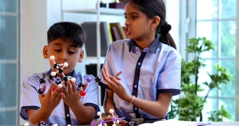 Indian School Kids Studying Atom Model Using 3D Tool in Classroom Science Stock Footage 342849979
