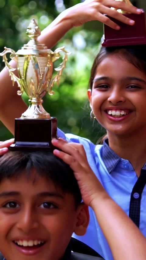 Indian School Kids in Uniform Flaunting Trophy Proudly While Standing Outside Stock Footage 342844367