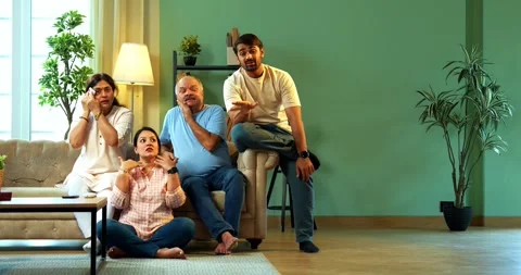 Indian Senior couple and young kids spending quality time on sofa Stock Footage 343607095