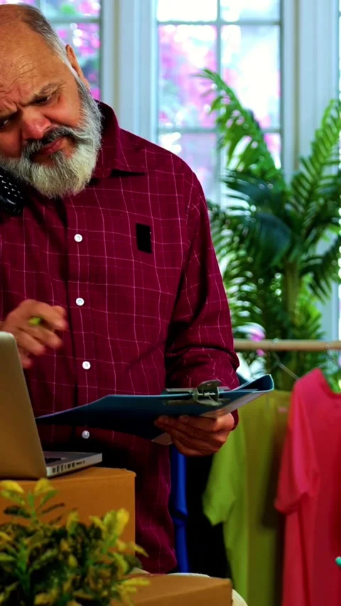 Indian senior couple doing E-commerce business from home Stock Footage 342756532