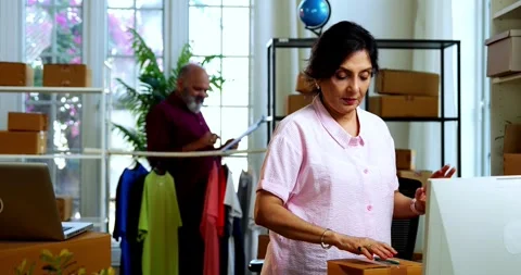 Indian senior couple doing E-commerce business from home Stock Footage 342779547