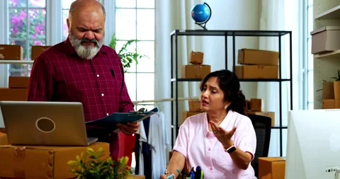 Indian senior couple doing E-commerce business from home Stock Footage 342779595