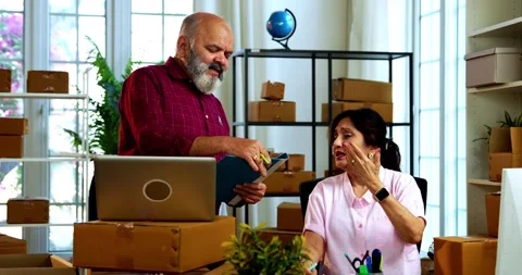 Indian senior couple doing E-commerce business from home Stock Footage 342779606