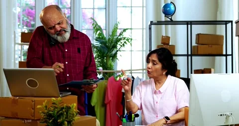 Indian senior couple doing E-commerce business from home Stock Footage 342779607