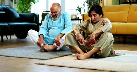 Indian senior couple doing stretching doing  warmup stretching or yoga at home Stock-Footage 342788051