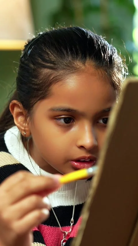 Indian siblings exploring creativity by painting on a canvas at home Stock Footage 343214437