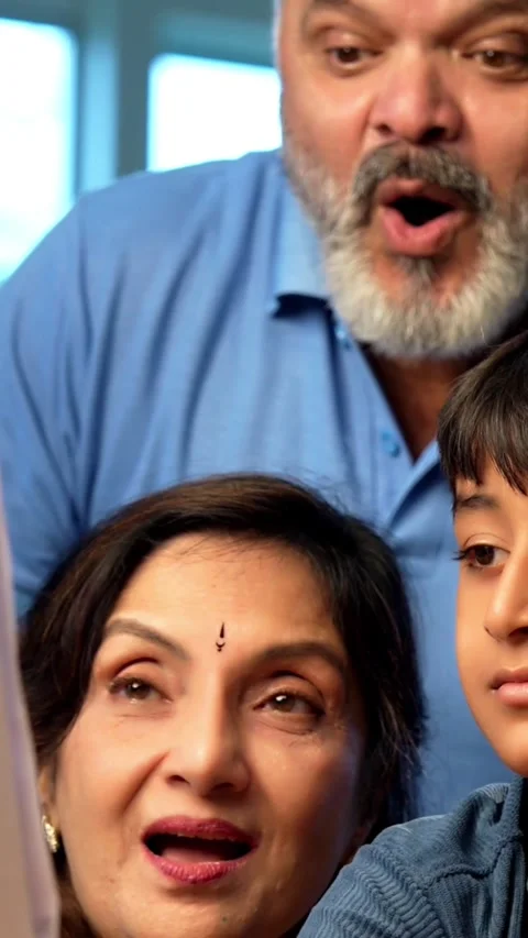 Indian small kid spending quality time with grandparents at home Stockbeeldmateriaal 342980430