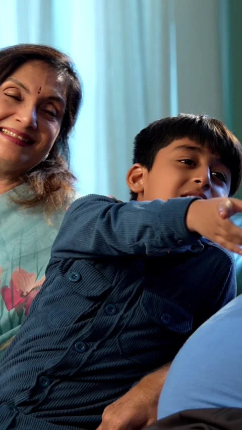 Indian small kid spending quality time with grandparents at home Stock Footage 342980573