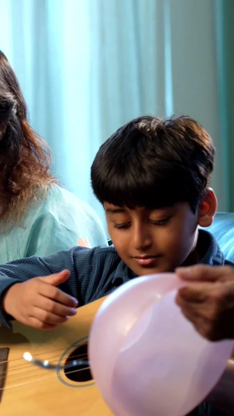 Indian small kid spending quality time with grandparents at home 스톡 동영상 342980624