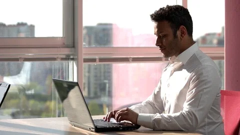 Indian smiling programmer working on laptop. Stock Footage 85449171