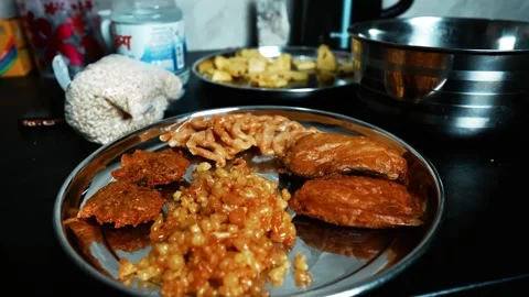 Indian Snacks and Sweets on Stainless Steel Plate, A stainless steel plate .. Stock Footage 304974034