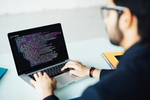 Indian software developer busy with work on new project. Indian programer wor Stock Photos