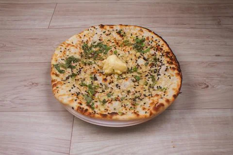 Indian special flat bread also known as tandoori butter kulcha or naan, serve 스톡 사진