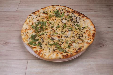 Indian special flat bread also known as tandoori kulcha or naan, served in a 스톡 사진