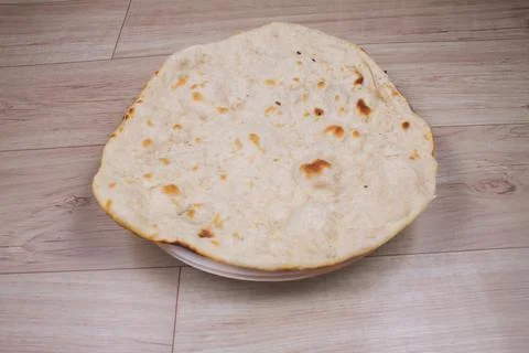 Indian special flat bread also known as tandoori roti or naan, served in a wh Foto stock