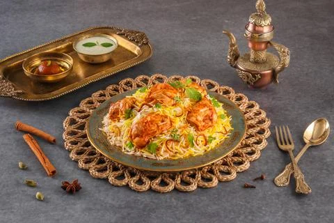 Indian spicy food Butter Chicken Biryani or Murgh Makhani Biryani with raita  Stock Photos