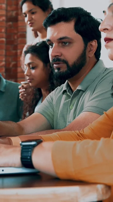 Indian startup programming team collaborating on laptops, computers Stock-Footage 342508110