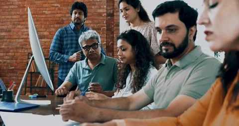 Indian startup programming team collaborating on laptops, computers Stock-Footage 342511158