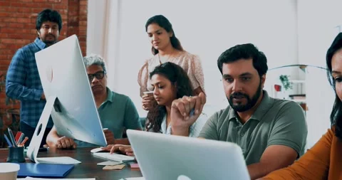 Indian startup programming team collaborating on laptops, computers Stock-Footage 342511286