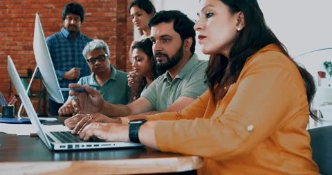 Indian startup programming team collaborating on laptops, computers Stock-Footage 342511298