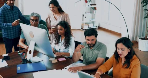 Indian startup programming team collaborating on laptops, computers Stock-Footage 342511301