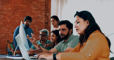 Indian startup programming team collaborating on laptops, computers Stock-Footage 342511418