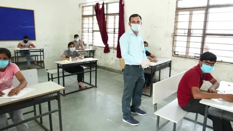 Indian Students in the Classroom Taking Exam/ Test wearing mask Stock Footage 139379284