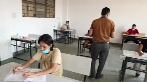 Indian Students in the Classroom Taking Exam/ Test wearing mask Stock Footage 139379301